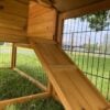 Ramp on large, natural wood rabbit hutch