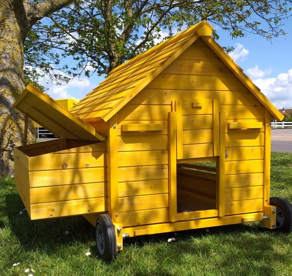 Portable chicken coop on wheels, with nest box