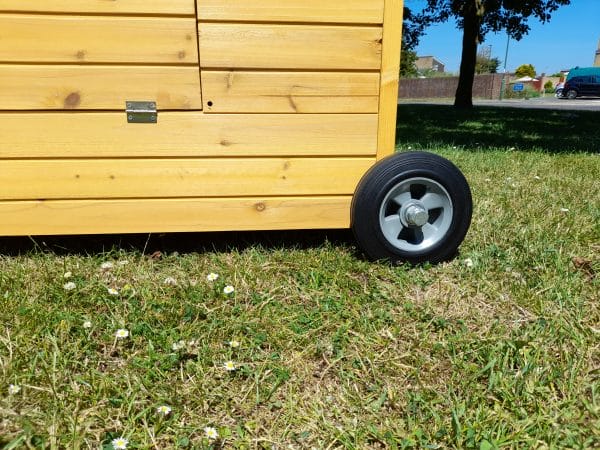 close up of wheels on a portable chicken coop - The Betty Air Design