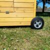 close up of wheels on a portable chicken coop - The Betty Air Design